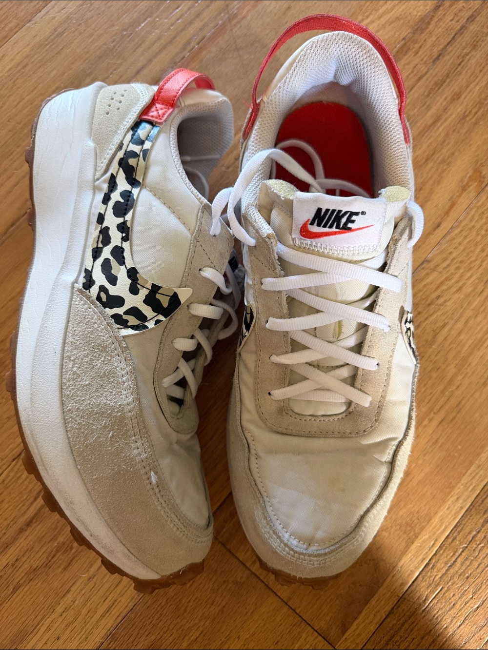 Nike Beige Sneakers with Leopard Swoosh and Red Accents